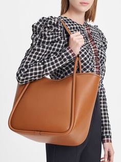 Cognac Tubular Slouchy Tote Bag | CHARLES & KEITH Slouchy Tote Bag, Charles And Keith, Extra Large Tote Bags, Circle Handle, Trapeze Bag, Chic Crossbody Bag, Slouchy Tote, Tote Bag Aesthetic, Bag Aesthetic