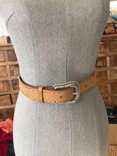 "This gorgeous Ariat western belt is in excellent condition. This could be a unisex belt. It is made of full grain leather and is embossed in a floral & fauna pattern. It is studded in silver and has a silver embossed western buckle. See photos for details. Originally $94. Size 34/85 Width 1 2/8\" Waist 31 1/2\" - 35 1/2\" (measuring closest to farthest hole)" Western Concho Belts For Ranch, Western Style Adjustable Belt With Removable Feature, Rustic Belts With Antique Buckle For Western-themed Events, Rustic Belt With Antique Buckle For Western Events, Rustic Belt With Antique Buckle For Western-themed Events, Western Belt With Antique Buckle And Adjustable Fit, Western Belts With Antique Buckle And Adjustable Fit, Rustic Concho Belts For Rodeo, Rustic Adjustable Belt With Concho Detail