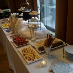 an assortment of desserts and snacks on a table