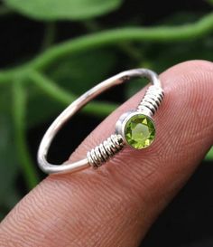 Silver Ring, Peridot Ring, Tiny Band Ring, Midi Stacking Ring, Daily wear Ring, Designer Ring, Customized ring size J TO Z Gemstone - Peridot ( please select your ring size in drop down menu ) Gemstone Shape - Round Customization: After you order, we will craft your selected ring as per your required ring size. Ring size chart is also uploaded. Handling Time - We will dispatch your item within 6-10 working days after confirmation of order. Shipping :- Domestic Shipping - We use Royal Mail UK/Hermes/DPD etc as for our delivery service as it is the most reliable and trustable service. normal delivery time is 5-6 working days. International Shipping - International Package Delivery Time is Approx. 10-15 working Days Thank you so much for visiting our Shop! We will do our best for your satisfa Adjustable Green Round Birthstone Ring, Adjustable Round Peridot Ring, Adjustable Peridot Ring, Ring Daily Wear, Peridot Ring, Stacking Ring, Stacking Rings, Custom Rings, Rings Statement