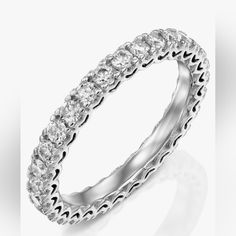 a white gold ring with rows of diamonds