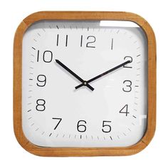 a square wooden clock with black hands on a white background