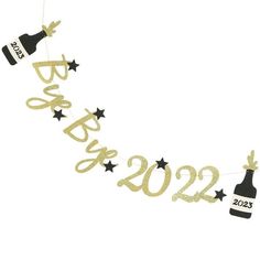 a happy new year banner with champagne and stars hanging from it's string, on a white background