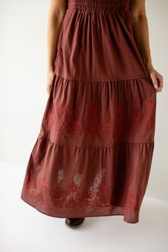 The 'Athena' dress is the perfect feminine staple to add to your closet! Easily transitioned throughout the year, the dress comes in a neutral taupe color, or a pretty merlot shade. The dress features flutter sleeves, an elastic waistband, tiered skirt, and dainty embroidered details on the front! 60% Cotton, 40% Polyester Shell 100% Polyester Lining Fully Lined Hand Wash Cold Hang or Lay Flat to Dry Do Not Bleach Low Iron If Needed Model in Merlot Height 5'9" | Wearing Size Small Model in Taupe Burgundy Cotton Dress For Spring, Spring Burgundy Cotton Dress, Athena Dress, Athena Dresses, Layered Tops, Embroidered Details, Tiered Maxi Dress, Taupe Color, Tier Skirt