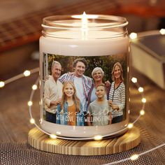 a candle with a family photo on it