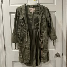 Size Small Buttoned Jacket Nwot Lots Of Pockets Long Jacket Jacket With A Lot Of Pockets, Spring Cotton Long Coat Parka, Cotton Long Coat Parka For Spring, Cotton Long Parka For Spring, Spring Long Coat Parka With Pockets, Spring Cotton Parka, Olive Cotton Outerwear For Fall, Spring Khaki Cotton Parka, Fall Utility Long Sleeve Parka