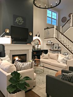 a living room filled with furniture and a fire place