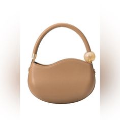 With Its Structured Shape And Marbled Pearl Accent, This Small Handbag Is Spacious Enough To Carry Your Phone, A Cardholder, Keys, And Your Favorite Compact Beauty Product. Opt To Go Hands-Free With The Crossbody Strap. Recycled Vegan Leather 8"W X 5.5"H X 1"D Handle Drop: 5.5" Strap Length: 45.5 -51.5" Zipper Closure Gold-Tone Hardware Oeko-Tex Certified Lining Fits Up To An Iphone 11 Pro Max Product No. Bc3240iv Color Tan Versatile Brown Bag With Round Handle, Brown Top Handle Bag With Single Handle, Chic Brown Bag With Round Handle, Beige Shopping Bag With Pearl Handle, Beige Bags With Pearl Handle For Shopping, Chic Satchel Bag With Pearl Handle, Elegant Everyday Hobo Bag With Single Handle, Elegant Tan Hobo Bag For Daily Use, Brown Bag With Removable Pouch And Round Handle