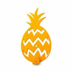 a yellow pineapple shaped bottle opener on a white background with an arrow pointing up at it