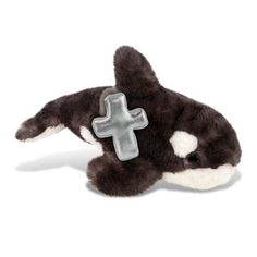 a stuffed animal with a cross on it's chest is laying in front of a white background