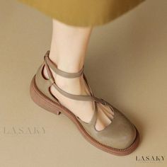 Summer Brown Closed Toe Mary Janes, Summer Mary Jane Flats With Round Toe, Adjustable Beige T-strap Sandals With Round Toe, Beige Adjustable T-strap Sandals With Round Toe, Leather Mary Janes With Ankle Strap For Summer, Summer Closed Toe Mary Jane Flats, Beige T-strap Sandals With Buckle Closure And Round Toe, Spring T-strap Sandals With Heel Loop And Round Toe, Summer Mary Jane Flats With Rubber Sole