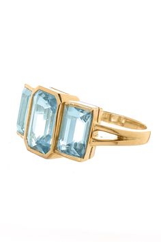 Yi Collection aquamarine tonal deco supreme ring. This unique Aquamarine ring is the perfect balance of masculine and feminine. This modern and classic design exudes our brand's spirit. 3 beautifully paired aquamarines lay across your finger elegantly. The superb color of these gems exudes the spirit of vitality and renewal. Aquamarine (3.89ctw) 18k Yellow Gold Luxury Light Blue Aquamarine Rings, Modern Gold Blue Topaz Ring, Modern Yellow Gold Topaz Ring With Center Stone, Modern Topaz Ring With Center Stone In Yellow Gold, Modern Formal Hallmarked Topaz Ring, Luxury Aquamarine Octagon Ring, Luxury Gold Aquamarine Rings, Luxury Octagon Aquamarine Ring, Modern Gold Rings With Blue Topaz