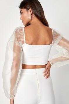 You'll get all the attention when you arrive at the party wearing the Lulus Sheerly Sultry Ivory Organza Balloon Sleeve Two-Piece Jumpsuit! Airy woven organza shapes sheer balloon sleeves (with elastic at the cuffs and shoulders) that frame a cropped bodice (composed of stretchy crepe knit) with flattering bust darts. Matching high-rise bottoms have wide pant legs. Hidden back zipper. Fit: This garment fits true to size. Length: Floor length. Size medium Inseam: 33.00 Front Rise: 12.00 Bust: Gre Fitted Crop Top With Sheer Sleeves For Summer, Summer Fitted Crop Top With Sheer Sleeves, Elegant Summer Crop Top With Sheer Sleeves, Chic Crop Top With Sheer Sleeves For Summer, Chic Summer Crop Top With Sheer Sleeves, Elegant Sheer Sleeves Crop Top For Spring, Elegant Spring Crop Top With Sheer Sleeves, Summer Party Crop Top With Sheer Sleeves, Sheer Fitted Crop Top For Party