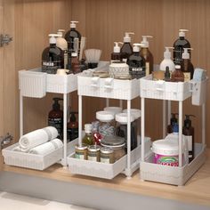 the bathroom shelf is organized with soaps, lotions and hand sanitizers