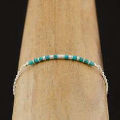 This dainty Dainty Turquoise Beaded Bracelet is handcrafted for you with great care. This bracelet has a delicate and feminine look. A great addition to your jewelry collection and will be a great gift for your December birthday. MATERIALS AND SIZE ◆ Metal - 14K Gold Filled, 925 Sterling Silver. ◆ Because I am using natural stones, the stones may vary slightly in shape, size, and colour. LINK TO THE MARCHING NECKLACE https://www.etsy.com/ca/listing/744850042/dainty-turquoise-necklace-natural?ref Bohemian Sterling Silver Beaded Bracelet With Tiny Beads, Sterling Silver Bohemian Beaded Bracelet, Turquoise Bracelets With Tiny Beads As Gift, Dainty Adjustable Turquoise Bracelet, Turquoise Bracelets With Tiny Beads For Gifts, Turquoise Bracelets With Silver Beads For Gift, Minimalist Beaded Turquoise Bracelet, Minimalist Turquoise Beaded Bracelets, Minimalist Turquoise Beaded Bracelet