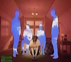 a dog is sitting in front of three blue figures that appear to be human size