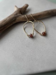 Meet the Isla Dangles, a delicate and beautiful dangle made with hand shaped, hammered and wrapped 14k gold fill and gemstones. Pictured in red aventurine. Available in several gem options. Measures 1.25” in length. All materials are 14k goldfill and with care will last a lifetime. Gold fill is 100x more bonded with gold, unlike plated gold which has a very fine dusting layer. It does not rub off or lose it’s shine and is hypoallergenic Dainty Teardrop Earrings With 14k Gold Filled, Dainty 14k Gold-filled Teardrop Earrings, Minimalist 14k Gold Filled Teardrop Dangle Earrings, Elegant Copper Teardrop Earrings Gift, Rust Hand Forged Earrings As Gift, Hand Forged Rust Earrings As Gift, Minimalist Wire Wrapped Teardrop Earrings, Teardrop Wire Wrapped 14k Gold Filled Hoop Earrings, Minimalist Teardrop Wire Wrapped Earrings