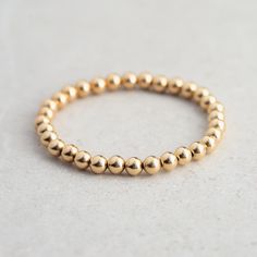 D E T A I L S △ Handmade in Canada △ 14K gold filled 6mm △ Durable stretch cord △ Multiple sizes available L E N G T H Please measure your wrist then add 1/2" to find your best fit. Select chosen size in the drop down menu. Please message me if you have any concerns or want some extra help ♡ These bracelets are available with a clasp and extender for adjustable fit here: https://www.etsy.com/ca/listing/1219787986/adjustable-gold-filled-beaded-ball?click_key=6d107dcfaff48548bb5156754cf630beb1b818 Everyday Gold Bracelet, Beaded Ball, Armband Gold, Gemstone Properties, Gold Armband, Ball Bracelet, Rishikesh, Stretchy Bracelets, Bracelet Gold