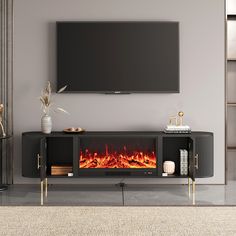 an entertainment center with a fire place and flat screen tv on the wall above it