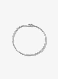 This 14k gold delicate tennis bracelet features 1.50ctw lab grown round diamonds. It's dainty size makes it the perfect tennis bracelet for daily wear on its own or stacked with other diamond and/or solid gold bracelets. Dainty Cubic Zirconia Tennis Bracelet For Everyday, Dainty Cubic Zirconia Tennis Bracelet In White Gold, Everyday White Gold Jubilee Tennis Bracelet, Dainty White Gold Tennis Bracelet With Cubic Zirconia, Dainty Diamond Tennis Bracelet For Everyday, Cubic Zirconia Tennis Bracelet For Everyday Wear, Classic White Gold Tennis Necklace For Everyday, Everyday Silver Brilliant Cut Tennis Bracelet, Everyday Cubic Zirconia Tennis Bracelet