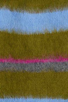 a close up view of the side of a blanket with pink and grey stripes on it