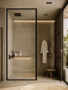 a bathroom with a walk in shower sitting next to a bench and a stool on the floor