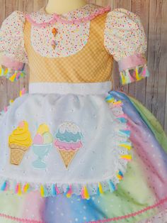 This is a beautiful Ice cream dress for your little one will look gorgeous in this dress, is perfect for a birthday ice cream party. The dress is made with 100% cotton fabric and all attention to detail This dress is made with 2 skirt layers, it has a ice cream appliqué that looks so cute on the dress just perfect for your little angel. The Dress is available from sizes 2 -8 years. Girls size Chest 2T 19'' 3T 21'' 4T 22'' 5T 23'' 6 24'' I use an underskirt just to show how puffy is the dress. if Ice Cream Applique, Ice Cream Birthday Party Outfit, Cream Birthday Dress, Ice Cream Outfit, Beautiful Ice Cream, Ice Cream Dress, Skirt Layers, Cream Outfit, Ice Cream Ice