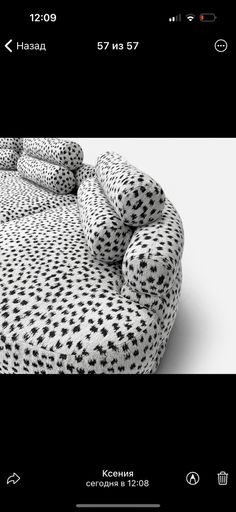 a black and white photo of a bed with polka dots on the sheets that have been made to look like an animal print