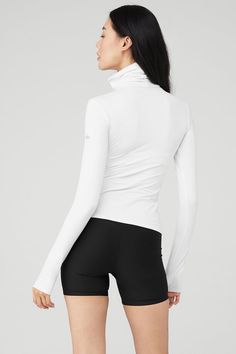 The epic, ultra-versatile Alosoft Refine Turtleneck is a year-round fave, thanks to velvety, warming-yet-breathable Alosoft. Turn up the heat in hot yoga or layer up on a cold day with a handy, fitted turtleneck for extra warmth. Pair this full-length top with matching Alosoft leggings for a perf studio-to-street look. White Knitwear, Fitted Turtleneck, Matching Leggings, Womens Capris, Street Look, Back Women, Tank Top Long Sleeve, Hot Yoga, Turn Up