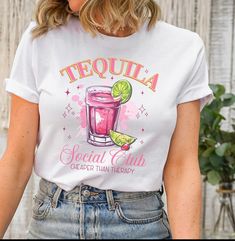 Get ready to embrace summer vibes with our Summer Shirt - the ultimate cocktail tee perfect for beach parties and social club gatherings. Whether it's for your friend vacation squad or a bachelorette party, this fun tee is sure to add a touch of summer fun to any occasion. HOW TO ORDER 1. Select Quantity 2. Select Color (If Available in Different Colors) 3. Add to Cart SHIPPING Ships in 1-4 Business Days Default Shipping is Ground LETS CONNECT Follow us on social media for sneak picks of your or Casual Summer Party Shirt, Summer Party Casual T-shirt, Party Tops For Beach Season With Short Sleeves, Summer Party Graphic Tee Shirt, Graphic Tee Shirt For Summer Parties, Summer Party Shirt With Funny Print, Cocktail Beach, Friend Vacation, Bachelorette Shirt