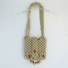 VINTAGE MACRAME SHOULDER BAG. nylon cording. Velcro flap closure. wooden bead accent.   the inside is has a basis I'd pocket. measures about 11 by 10 by 3. 14 inch handle drop. Beige Macrame Shoulder Bag, Beige Macrame Tote Shoulder Bag, Cream Macrame Shoulder Bag For Daily Use, Rectangular Macrame Crochet Bag For Travel, Beige Rectangular Shoulder Bag With Macrame, Beige Macrame Rectangular Shoulder Bag, Beige Rectangular Macrame Shoulder Bag, Beige Crochet Shoulder Bag With Macrame, Everyday Macrame Crochet Crossbody Bag