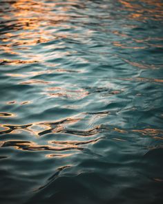 the water is very calm at sunset