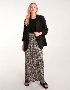 Whether you're vacationing or staycation-ing, these wide leg trousers are a staple pick. Finished with a flattering shirred waistline, they're also illuminated by the abstract print, perfect on those warm weather days. Partner with gold sandals to complete the look. 92% Polyester, 5% Elastane Made in ChinaMachine washableWide leg Shirred waistUnfastenedModel wears size SModels height: 173cm / 5ft 8 Black Viscose Wide Leg Pants For Spring, Chic Black Viscose Wide Leg Pants, Black Linen Trousers, Maternity Trousers, Blouse Sale, Gold Sandals, Curve Dresses, Black Abstract, High Waisted Trousers