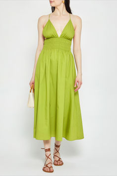 The Nann Dress features a plunge neckline and adjustable tie straps. The cinched waist with comfortable smocking provides a flattering fit for any body type. Summer V-neck Midi Dress With Drawstring, Chic Midi Dress With Drawstring For Vacation, Summer V-neck Midi Dress With Ruched Bodice, Green Midi Dress With Elastic Waistband For Summer, Spring Dresses With Spaghetti Straps And Elastic Waistband, Sundress Season, Plunge Neckline, Anine Bing, Price Comparison