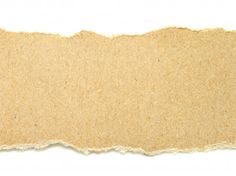 a piece of brown paper with torn edges