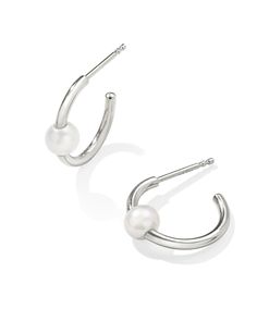 Invest in truly timeless style with the Emmaline Sterling Silver Huggie Earrings in Freshwater Cultured Pearl. These heirloom-quality huggies boast shimmering freshwater cultured pearls in a front-facing design, sparking immediate interest (and instant obsession). Metal Sterling Silver Why Sterling Silver? Our Sterling Silver collection features elevated styles to wear time and time again. With a base of both pure silver and copper, Sterling Silver provides a precious yet affordable option that Silver Huggie Earrings, Huggie Earrings Silver, Silver Strand, Silver Collection, Demi Fine Jewelry, Huggie Earrings, Sterling Silver Necklace Pendants, Freshwater Cultured Pearls, Silver Pendant Necklace