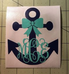 an anchor with a bow and monogrammed initials