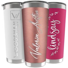 three personalized tumblers with the names of two different people on them, one in pink and one in white