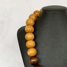 Modern Wood Necklace, Color Block Necklace, Chunky Wood Necklace Unisex Wood Necklace, Wood Bead Necklace, Two Tone Wood, Wooden Necklace This fun necklace was hand beaded using a mix of large 25mm round brown and tan wooden beads in a modern color block design. The necklace measures approximately 23 inches long and is securely fastened with a silver clasp. The end result is a chic bohemian piece that fits in perfectly with today's fashion trends! Perfect for any gender. Length can be adjusted i Wooden Beads Necklaces For Jewelry Making, Round Wooden Beads Necklaces For Jewelry Making, Unique Beaded Necklace With Round Wooden Beads, Brown Large Beads Costume Necklace, Brown Costume Jewelry Necklaces With Large Beads, Brown Round Bead Necklaces For Jewelry Making, Unique Brown Necklace With Spacer Beads, Costume Jewelry Beaded Necklace With Wooden Round Beads, Brown Necklaces With Colorful Round Beads