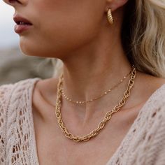 Kris Choker Necklace is the perfect dainty layering necklace! The gorgeous chain is stainless steel with gold plating, and it will not tarnish with minimal care. Layer it with all your favorite necklaces, or wear it alone for a chic, minimal look. 18K Gold Plating on Stainless Steel. Waterproof. About 13.5 in + 2 in. extension 14k Gold Filled Chain Link Necklace With Adjustable Chain, Delicate Charm Necklace With Chain For Everyday, Gold Plated Delicate Chain Necklace, Delicate Gold-plated Chain Necklace, Dainty 14k Gold Filled Chain Necklace For Everyday, 14k Gold Filled Necklace With Adjustable Chain, Dainty Tarnish-resistant Choker Chain Necklace, Trendy 14k Gold Jewelry With Delicate Chain, Trendy Gold Layered Necklace With Paperclip Chain