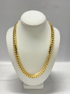 Indulge in the timeless elegance of our Cuban link chains and bracelets, meticulously handcrafted to perfection. Each piece is a solid statement of craftsmanship, created with passion and precision. Our Cuban link collection is plated not once, not twice, but five times with a lavish 14K Gold polish, ensuring a radiant and opulent finish that exudes sophistication. Embrace the uniqueness of handmade jewelry, where each link is carefully assembled to create a one-of-a-kind masterpiece. Our commit Oval Link Chain Necklace For Anniversary, Luxury Chain Necklace For Anniversary, Polished Yellow Gold Cuban Link Jewelry, Cuban Link Necklace With Solid Link Construction, Cuban Link Necklace With Solid Link Construction As Gift, Cuban Link Jewelry With Adjustable Chain For Anniversary, Anniversary Jewelry With Adjustable Cuban Link Chain, Gift Cuban Link Necklace With Solid Construction, Luxury Gold Chain Necklace For Anniversary