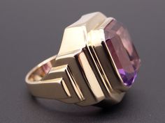 Jewelry Type: Gemstone Ring Metal: 14k Yellow Gold Markings: 14k Measurements: 19mm wide ( front face of ring) 4mm wide back of shank (most narrow area of band) 9mm high ( finger to top of ring) Weight: 13.9grams Main Stone: Emerald Cut Amethyst Gem Measurements: 14mm x 11.5mm x 7.5mm Gem Weight: 8ct total approx US Finger Size: 7 #7771 Wide Band Gemstone Rings For Formal Occasions, Formal Wide Band Gemstone Ring, Art Deco Yellow Gold Amethyst Ring For Formal Occasions, Formal 14k Gold Amethyst Ring In Art Deco Style, Modern Yellow Gold Amethyst Ring For Formal Occasions, Art Deco 14k Gold Amethyst Ring For Formal Occasions, Formal 14k Gold Art Deco Amethyst Ring, Classic Purple Signet Ring For Formal Occasions, Formal Art Deco 14k Gold Amethyst Ring