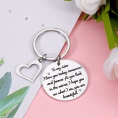 a keychain with the words to my sister i love you baby, someone and forever for you look in the mirror