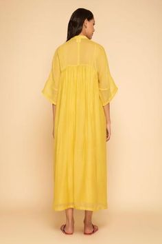 Yellow dress with floral embroidery around the neckline and mandarin collar. Comes with inner slip.
Component: 2
Embroidered
Neckline: Mandarin Collar
Sleeve Length: Three Quarter
Fabric: Chanderi Cotton
Color: Yellow
Front button placket - Aza Fashions