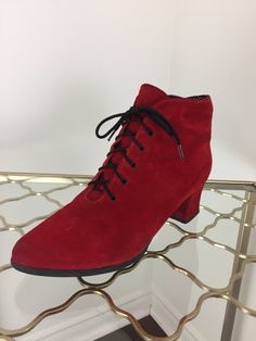 Classic red suede lace up granny booties by Grand Canadian. Please see further details below. Label - Grand Canadian Made in Canada Leather and man made materials. Wool lined interior Bendable rubber sole Size 6.5 - 7 US  2" heel 6" tall  Widest part of exterior sole is approximately 3.2"  Interior sole length 8.75" approximately Front lace up closure. Very good vintage condition. Some scuffs to suede and heels. Please see photos. Sold as is. I ship from Canada. Shipping is based on weight and v Fall Ankle Boots, Boots Fall Ankle, Granny Boots, Steampunk Victorian, Floral Pencil Skirt, Yellow Ties, Lace Up Booties, Wide Cuff, Suede Lace