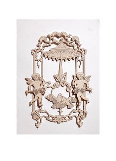 an intricately carved wooden frame with angels and cherubs