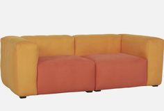 an orange and yellow couch sitting next to each other