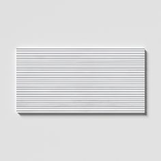 a white rectangular object with vertical lines on it