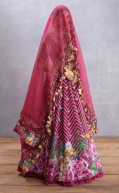 Editor's Note Featuring Manika Saadat Gul Lehenga Set Color: Ruby Red Fabric: Thin Handwoven Chanderi, Pure Cotton Silk, Dupion, Cancan, Sheer Silk Organza Components: Lehenga, blouse and dupatta Occasion: Sangeet Care: Dry Clean Only About the Designer Torani by Karan Torani stands handcrafted luxury inspired by the myriad tales of Indian mythology. Torani is a potpourri of all things nostalgic that binds you with a memory long forgotten. The label works with and revives timeless Indian textile Torani Designer, Indian Mythology, Blouse Yoke, Personal Shopping Service, Lehenga Blouse, Indian Textiles, Silk Organza, Red Fabric, Potpourri