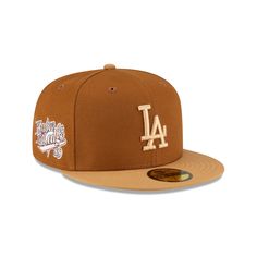 The Union X Los Angeles Dodgers Brown 59FIFTY Fitted Hat features an embroidered Dodgers logo at the front panels with a Union logo at the rear. Additional details include a 1989 Know The Ledge patch at the right-wear side and a green undervisor. Brown Snapback Baseball Cap With Embroidered Logo, Brown Baseball Cap With Embroidered Logo, Six-panel Baseball Hat With Logo Patch, Classic Brown Baseball Cap For Streetwear, Brown Snapback Hat For Baseball Season Streetwear, Vintage Brown Baseball Cap With Embroidered Logo, Streetwear Fitted Hat With Logo Patch For Baseball Season, Retro Fitted Hat With Flat Bill For Fans, Throwback College Cap